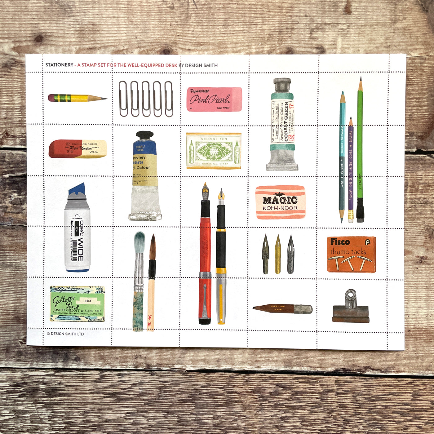 Sheet of decorative stamps illustrating stationery items including pens, brushes, and washi tape.