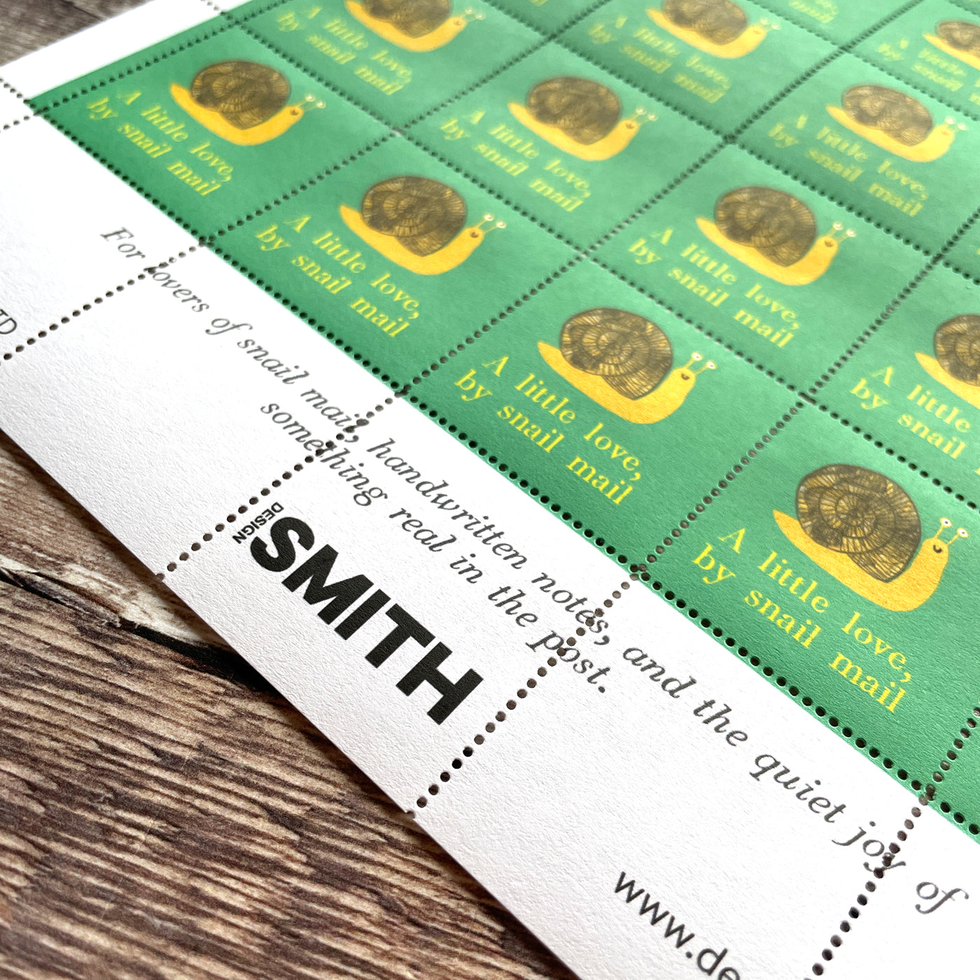Sheet of thirty decorative stamps illustrating a snail with the phrase a little love by snail mail.