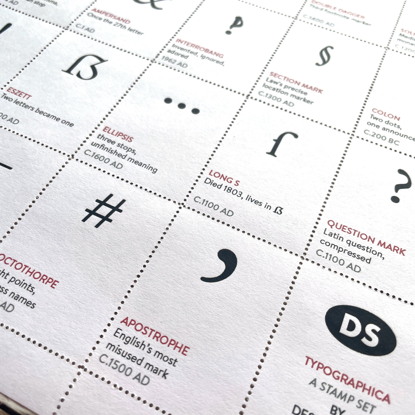Sheet of thirty decorative typographic mark stamps, hand-perforated and gummed.
