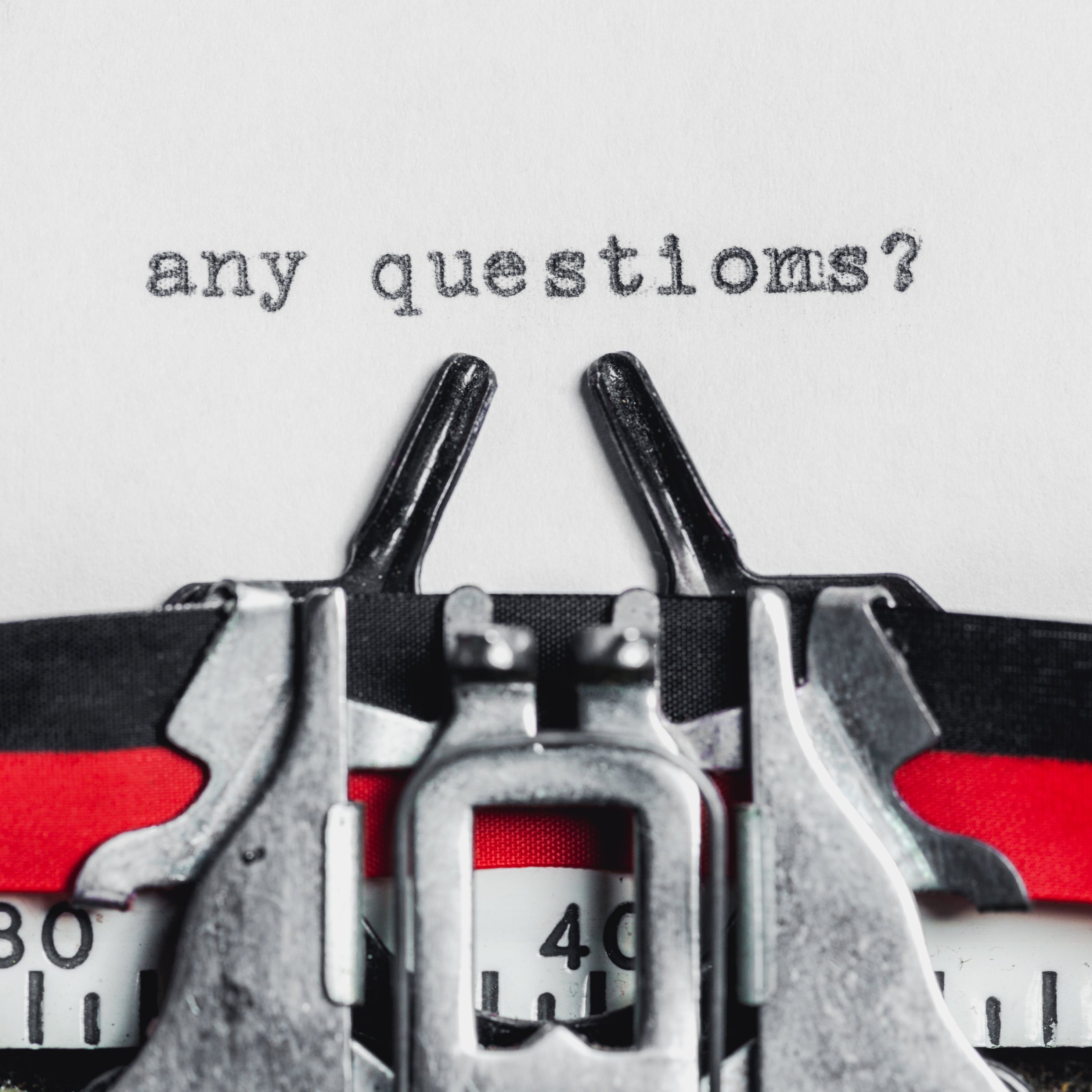 Vintage typewriter illustrating our trade FAQs